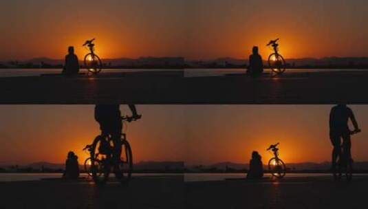 日落时分骑着自行车剪影高清在线视频素材下载