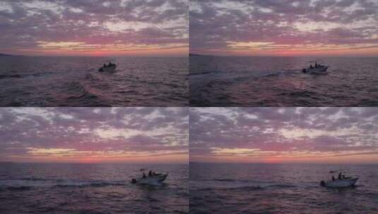 海边夕阳晚霞中行驶的快艇高清在线视频素材下载