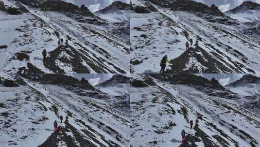 航拍攀登岷山山脉主峰雪宝顶雪山的登山队高清在线视频素材下载