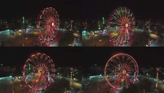 夜晚游乐场上的红色摩天轮高清在线视频素材下载