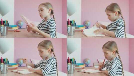 在书桌前打开笔记本写作业的女孩高清在线视频素材下载
