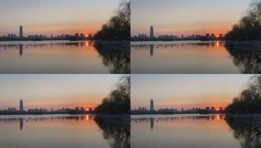 济南大明湖日落，湖面平静的夕阳高清在线视频素材下载