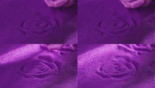 紫色沙子上的玫瑰印记被慢慢覆盖高清在线视频素材下载