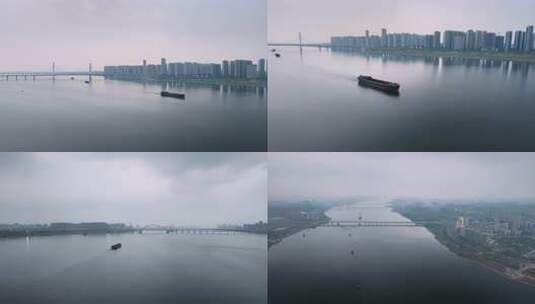 南昌航拍江上货船与城市建筑全景高清在线视频素材下载