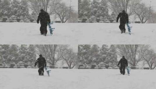 一名男子拖着他的滑雪板高清在线视频素材下载