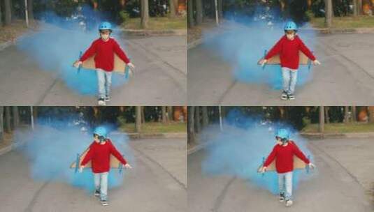 小男孩戴着烟雾飞行器奔跑高清在线视频素材下载