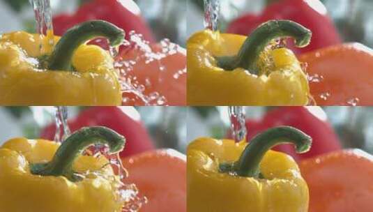 水流倒在黄椒红椒上的慢镜头高清在线视频素材下载