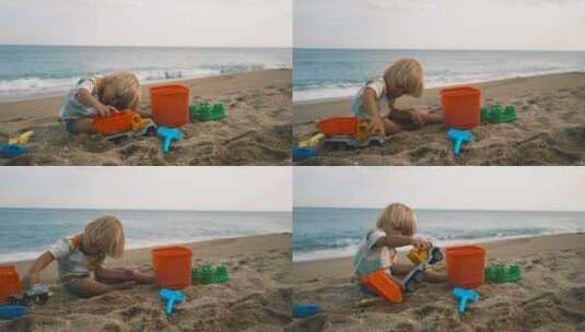 一个孩子在海滩沙滩上玩玩具高清在线视频素材下载