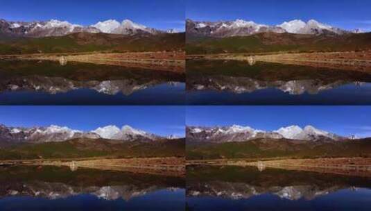 玉龙雪山和湖泊水面的雪山倒影高清在线视频素材下载