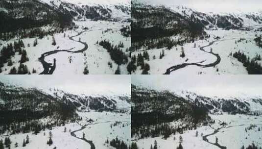 无人机在白雪皑皑的阿拉斯加山区的一条小河高清在线视频素材下载