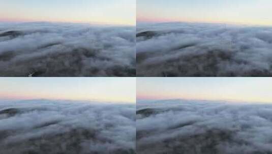 马德拉岛日落时，低云带着风力涡轮机穿过田高清在线视频素材下载