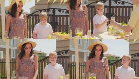 妈妈和儿子在外面卖柠檬水高清在线视频素材下载