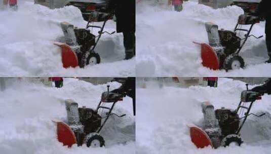 一名男子用吹雪机清除积雪高清在线视频素材下载