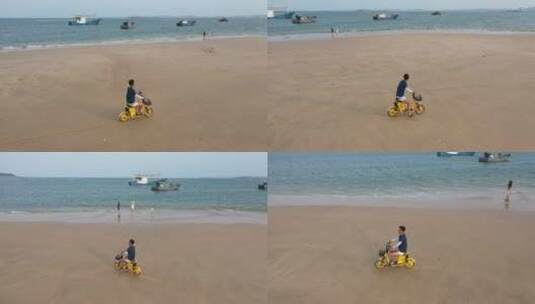 航拍福建平潭海边的沙滩人在骑车高清在线视频素材下载