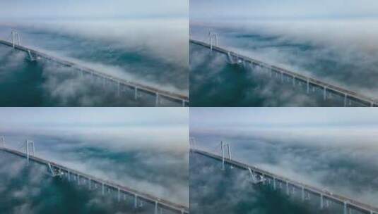 云海中的大连星海湾大桥高清在线视频素材下载