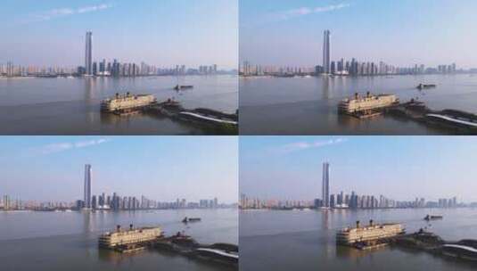 航拍武汉城市天际线高楼与长江知音号游轮高清在线视频素材下载
