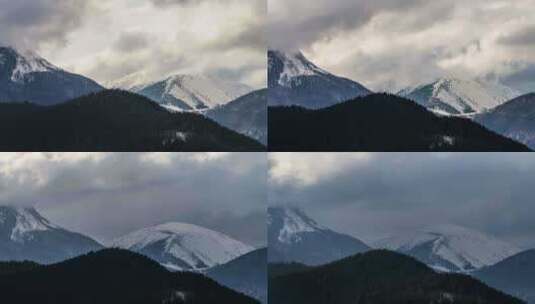 白雪皑皑的高山上戏剧性的云彩高清在线视频素材下载