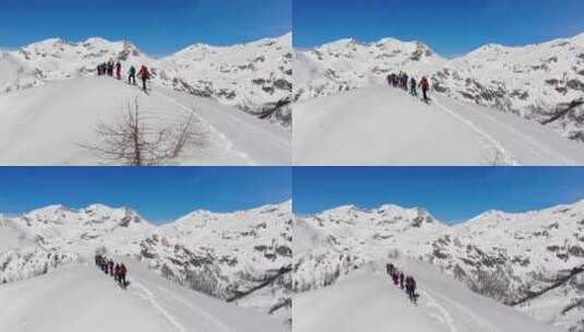 一群人在雪山中行走高清在线视频素材下载