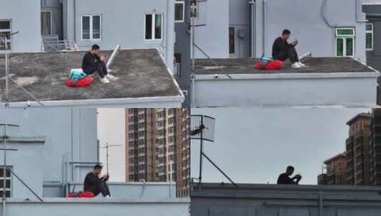 香港铜锣湾站在楼顶男子航拍高清在线视频素材下载