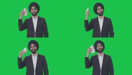 快乐的锡克教印度商人用钱当粉丝绿屏高清在线视频素材下载