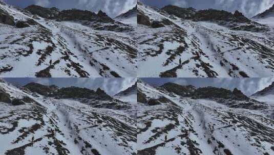 航拍攀登岷山山脉主峰雪宝顶雪山的登山队高清在线视频素材下载