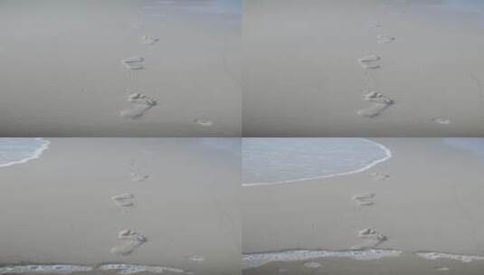 竖屏拍摄海滩上的脚印高清在线视频素材下载