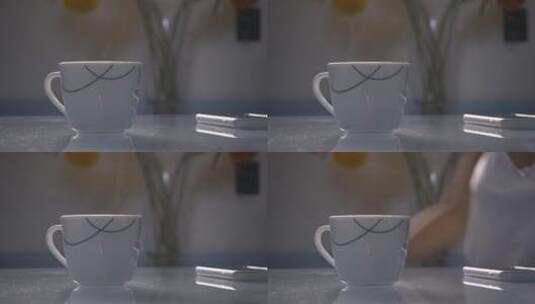 前景中有热早晨咖啡的杯子高清在线视频素材下载