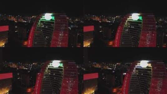 海口市新海航大厦夜景左移看见海南大厦高清在线视频素材下载