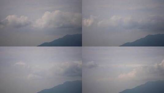 山峰中蓝天白云的风起云涌延时4k高清在线视频素材下载
