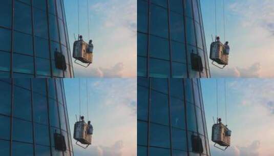 蜘蛛人工人在摩天大楼悬挂上升高清在线视频素材下载
