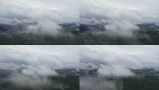城市高空云雾在镜头前快速飘过高清在线视频素材下载