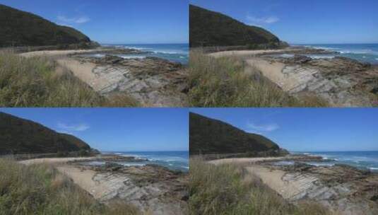 海滩上的杂草和岩石高清在线视频素材下载