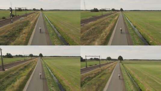 在美丽大自然乡村公路小道上骑自行车的人高清在线视频素材下载