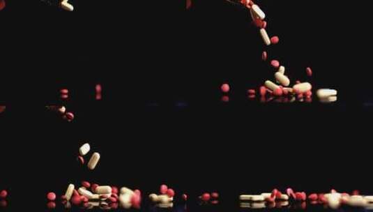药丸、胶囊和药片落在黑色背景上高清在线视频素材下载