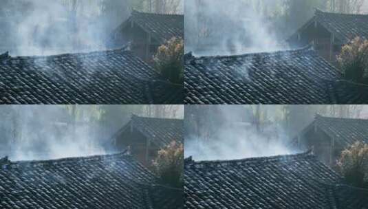清晨乡村瓦房屋顶上的炊烟高清在线视频素材下载