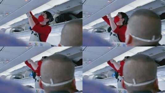 民航航空飞机上，空姐正在帮游客整理行李高清在线视频素材下载