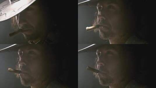 男人的嘴角叼着雪茄高清在线视频素材下载