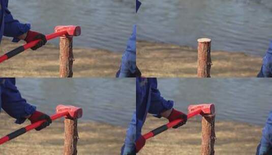 工人使用锤子砸木桩安装木桩高清在线视频素材下载