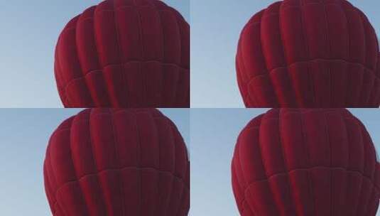 红色气球在晴朗的蓝天上飞行高清在线视频素材下载