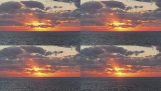 大海夕阳日落阳光穿过云层海面日落高清在线视频素材下载