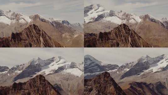 巍峨山峰山脉山峦航拍阳光下的雪山高清在线视频素材下载