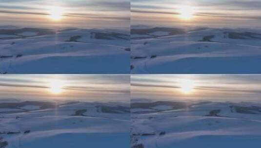航拍严冬中的辽阔暮色雪原高清在线视频素材下载