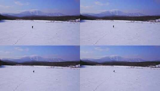 东北黑龙江漠河人物在雪地奔跑航拍风景高清在线视频素材下载