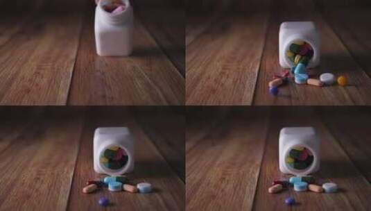 瓶子里倒出来了各种颜色的药片高清在线视频素材下载