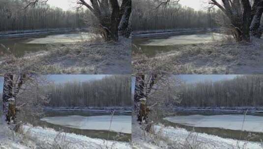 银装素裹的森林中一大块浮冰从河流流过高清在线视频素材下载