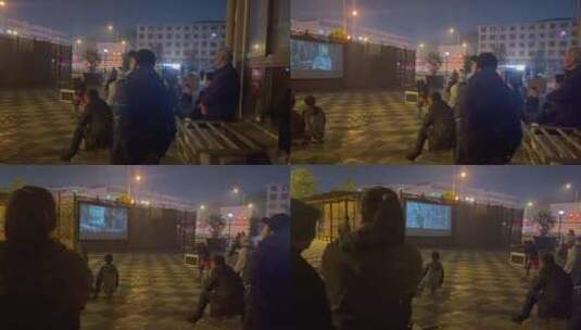 夜晚广场看幕布电影的居民5高清在线视频素材下载