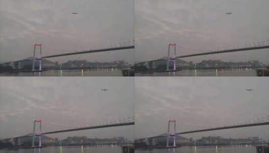 福建厦门海沧大桥上飞过的航班高清在线视频素材下载