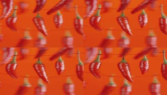 4K竖屏悬挂着的红辣椒掉落高清在线视频素材下载