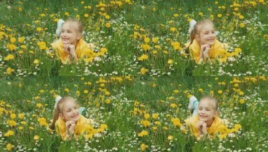 微笑的女孩躺在草地上看着镜头高清在线视频素材下载