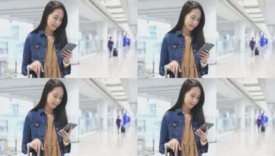 女孩在机场使用手机高清在线视频素材下载